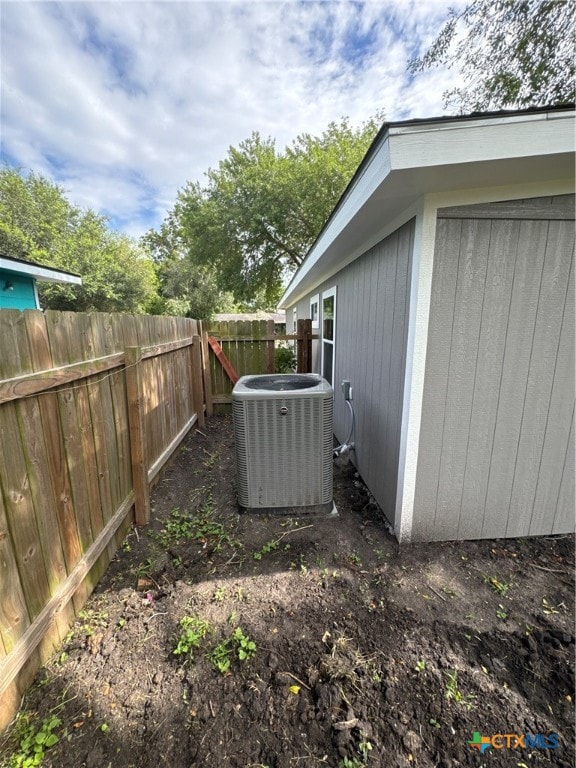 view of yard featuring central air condition unit