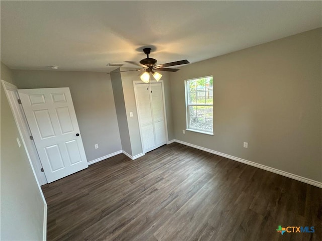 3004 Mayfair Dr, Victoria, TX 77901 - unfurnished bedroom with baseboards, dark wood-style floors, a closet, and ceiling fan