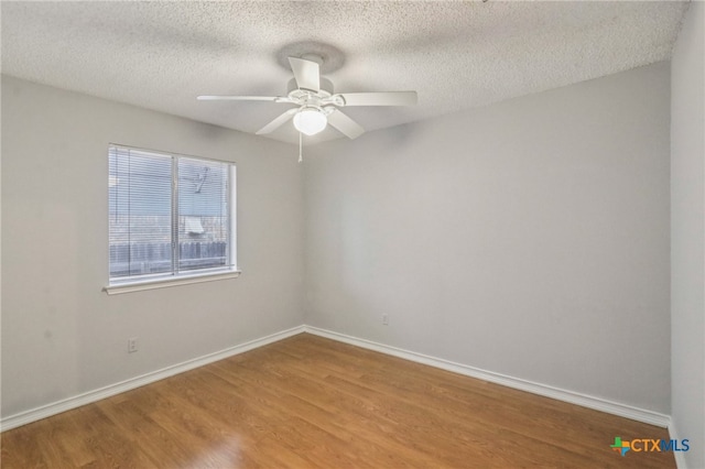 7401 Napier Trl, Austin, TX 78729 - unfurnished room with light wood-type flooring, a ceiling fan, and a textured ceiling
