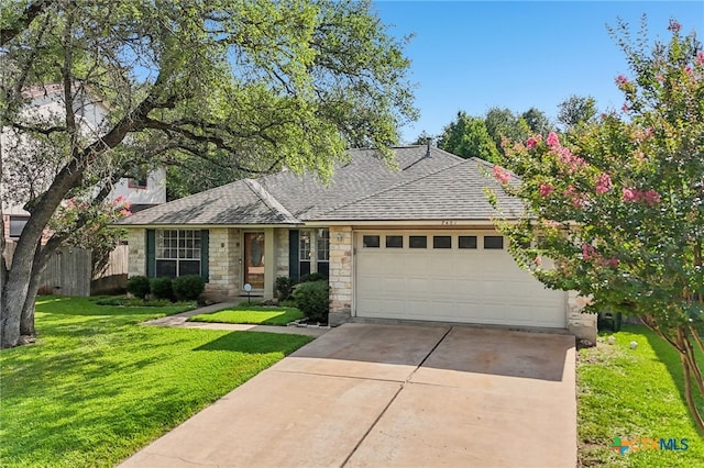 7401 Napier Trl, Austin, TX 78729 - view of front facade with a garage, stone siding, concrete driveway, and roof with shingles