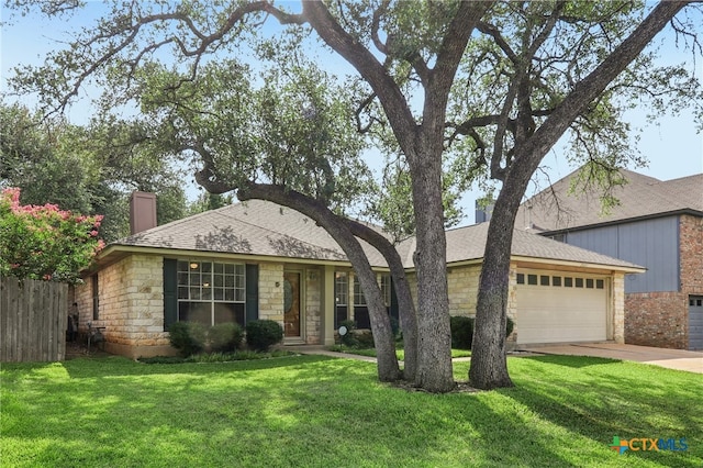 7401 Napier Trl, Austin, TX 78729 - ranch-style house with a chimney, stone siding, an attached garage, concrete driveway, and roof with shingles