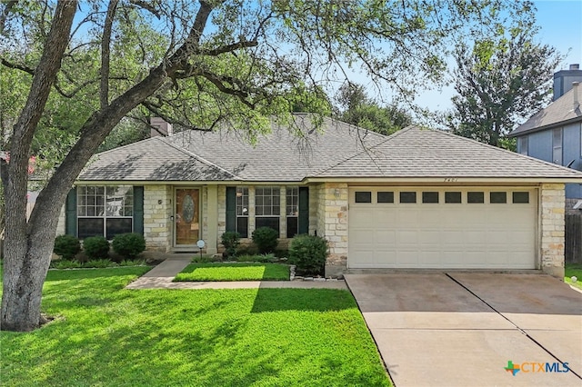 7401 Napier Trl, Austin, TX 78729 - view of front of home with stone siding, a garage, and driveway