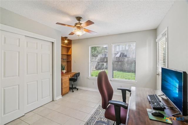 7401 Napier Trl, Austin, TX 78729 - office space with a ceiling fan, light tile patterned floors, and a textured ceiling