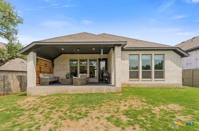 343 Sugarcane, New Braunfels, TX 78132 - rear view of house featuring a lawn, brick siding, an outdoor living space, and a fenced backyard