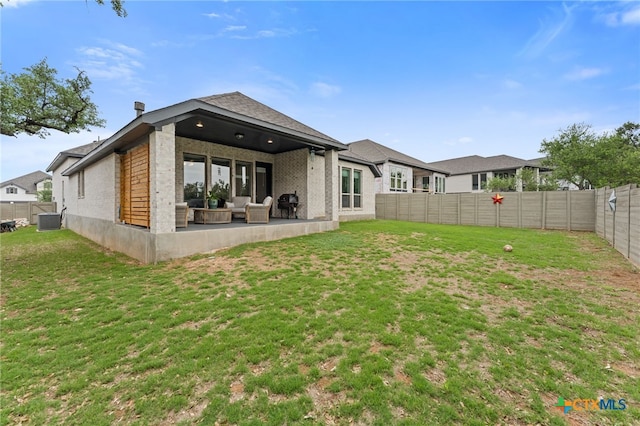 343 Sugarcane, New Braunfels, TX 78132 - back of house featuring a fenced backyard, a yard, a patio, and central AC