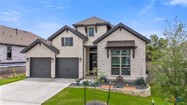 343 Sugarcane, New Braunfels, TX 78132 - view of front facade with concrete driveway, brick siding, stone siding, and a front yard