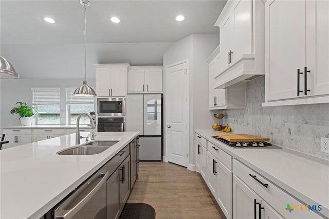343 Sugarcane, New Braunfels, TX 78132 - kitchen with stainless steel appliances, light countertops, a sink, and recessed lighting