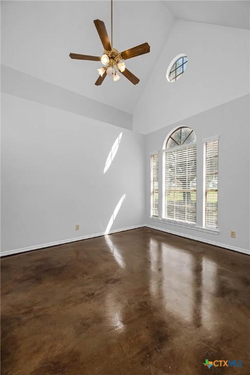 interior space with high vaulted ceiling and ceiling fan