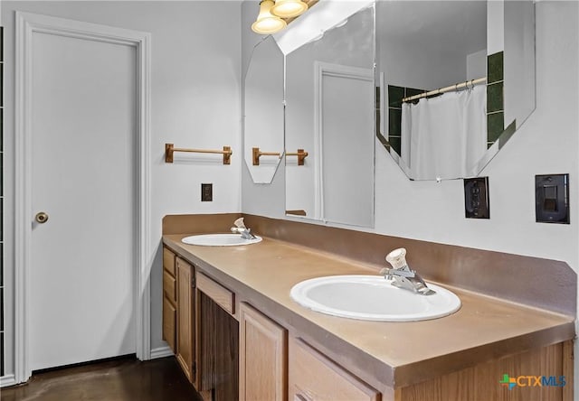 bathroom featuring vanity and a shower with shower curtain