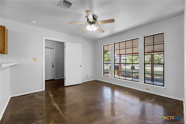 spare room with ceiling fan