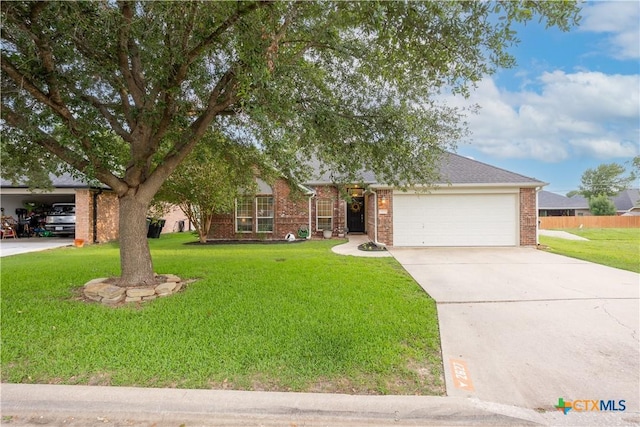 2627 Butterfly Dr, Temple, TX 76502 - view of front of property featuring an attached garage, brick siding, a front yard, and concrete driveway