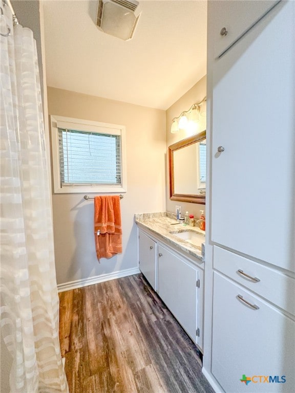 bathroom featuring hardwood / wood-style floors and vanity