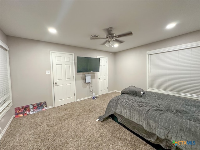 carpeted bedroom with ceiling fan