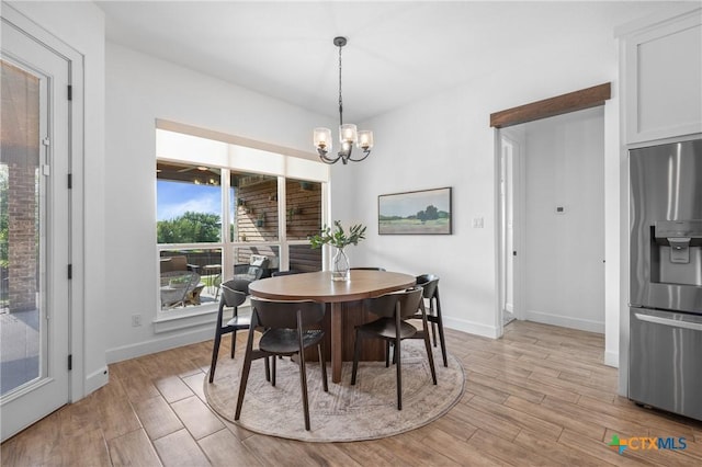 2037 Heritage Loop, Nolanville, TX 76559 - dining space featuring a chandelier and light wood finished floors