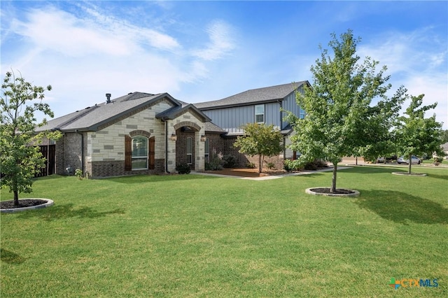2037 Heritage Loop, Nolanville, TX 76559 - view of front facade with board and batten siding and brick siding