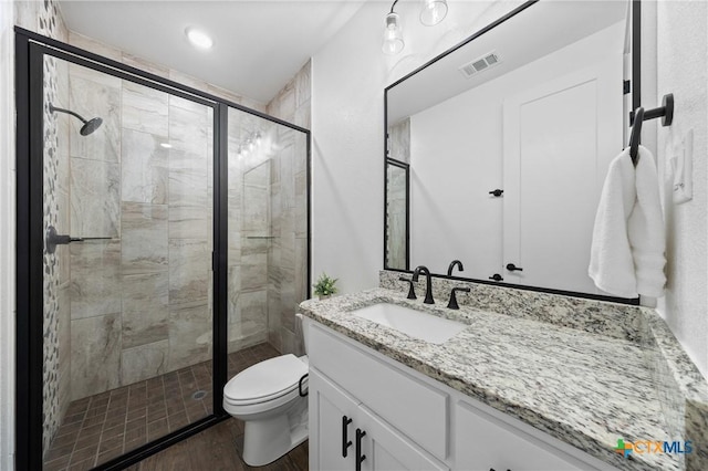 2037 Heritage Loop, Nolanville, TX 76559 - bathroom featuring vanity, wood finished floors, and a shower stall