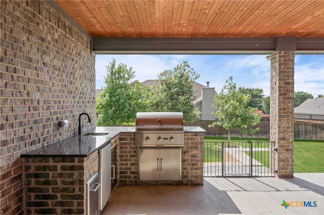 2037 Heritage Loop, Nolanville, TX 76559 - view of patio featuring exterior kitchen and a sink