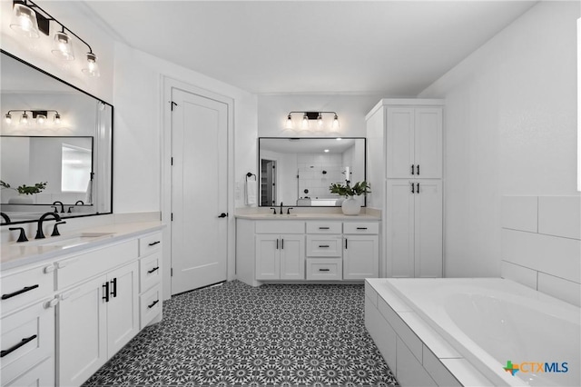 2037 Heritage Loop, Nolanville, TX 76559 - bathroom with two vanities, a garden tub, tile patterned floors, and tiled shower