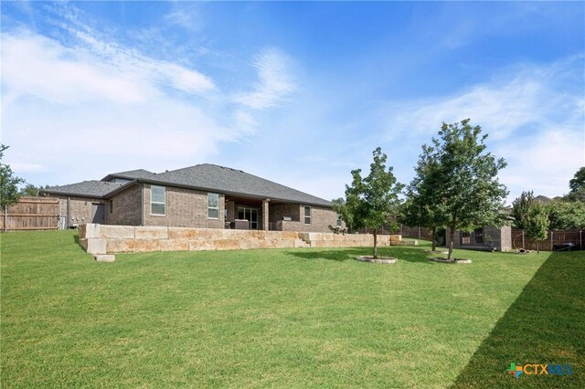 2037 Heritage Loop, Nolanville, TX 76559 - back of property featuring brick siding
