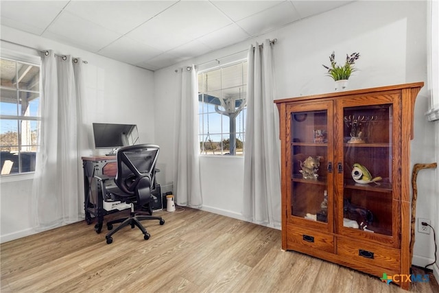 home office featuring light wood-style floors and a wealth of natural light