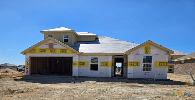 property in mid-construction featuring a garage