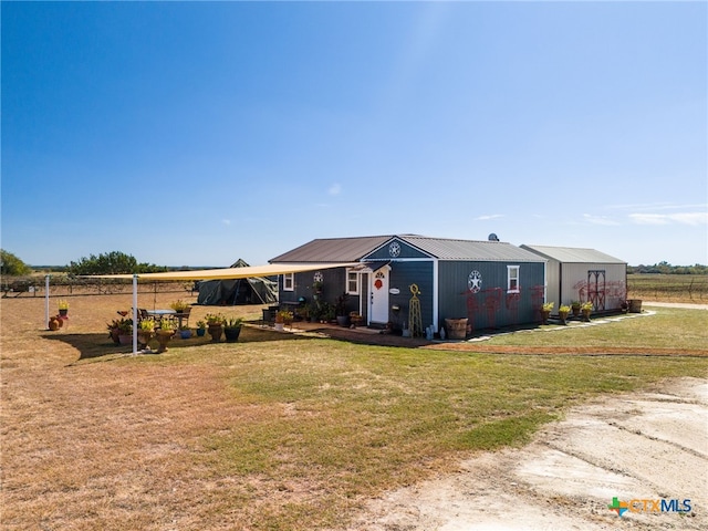 single story home featuring a front yard