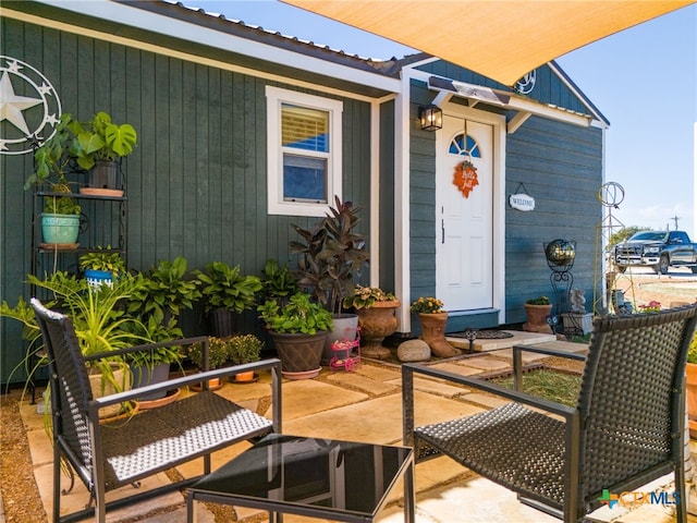 entrance to property with a patio area