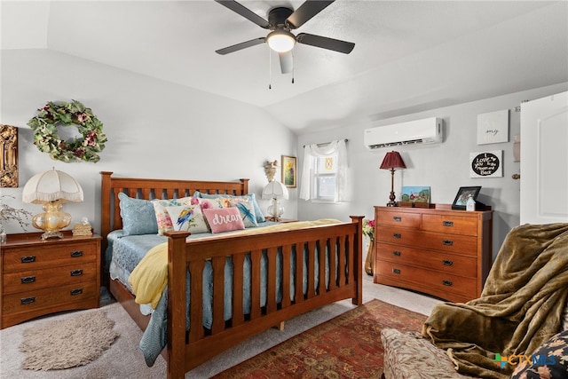 bedroom with ceiling fan, an AC wall unit, vaulted ceiling, and light colored carpet