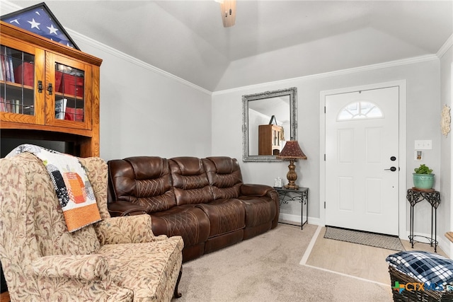 carpeted living room with ceiling fan and ornamental molding