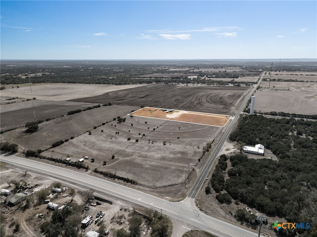 birds eye view of property with a rural view