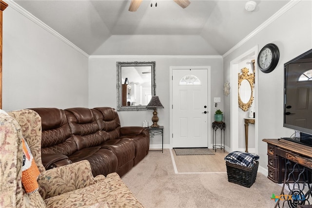 living room with ceiling fan, lofted ceiling, light colored carpet, and ornamental molding