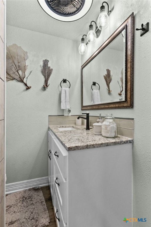 bathroom featuring vanity and hardwood / wood-style flooring