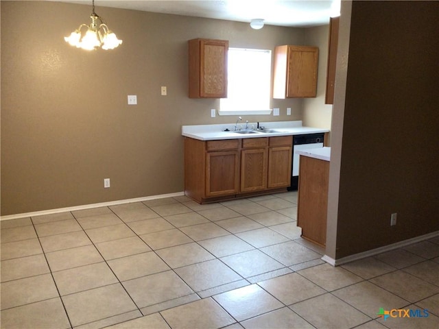 kitchen with pendant lighting, sink, dishwasher, a notable chandelier, and light tile patterned flooring