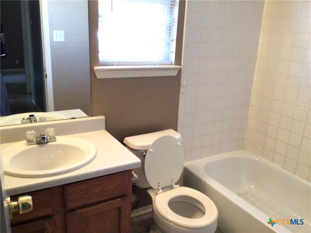 full bathroom with vanity, shower / tub combination, and toilet