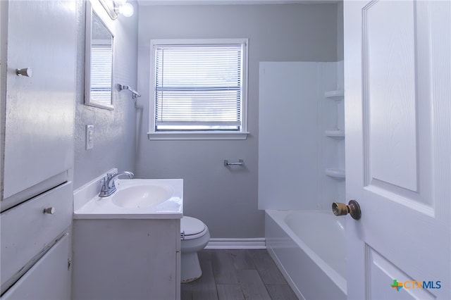 bathroom featuring hardwood / wood-style floors, vanity, and toilet