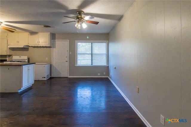 kitchen with white cabinets, dark hardwood / wood-style floors, white appliances, and ceiling fan