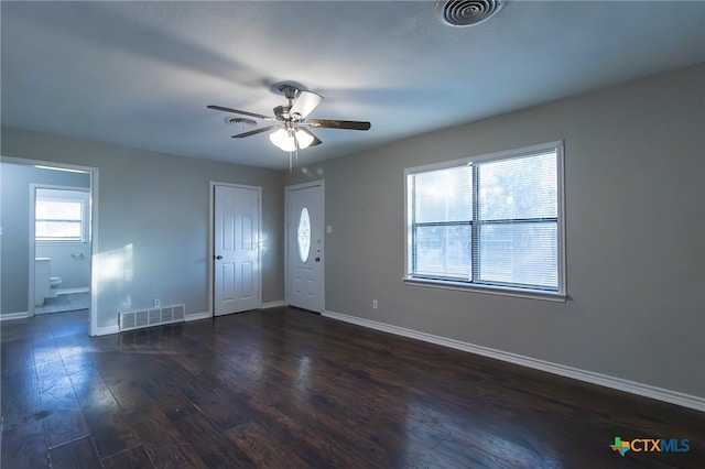 foyer entrance with dark hardwood / wood-style flooring and ceiling fan