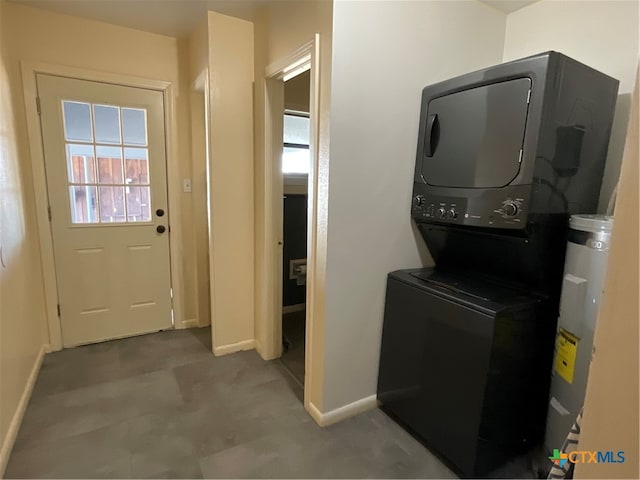 laundry area with stacked washing maching and dryer