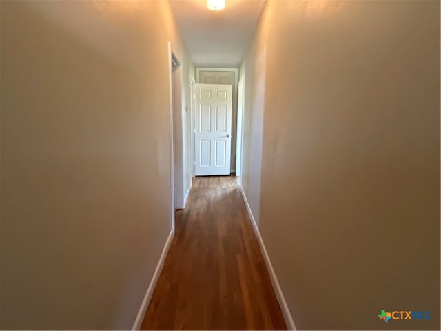 hall with wood-type flooring