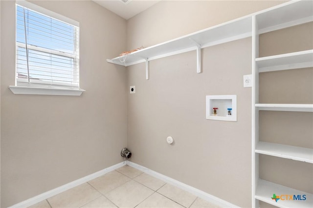 washroom featuring washer hookup, tile patterned flooring, baseboards, hookup for an electric dryer, and laundry area