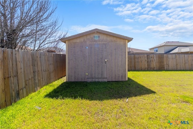 view of shed featuring a fenced backyard