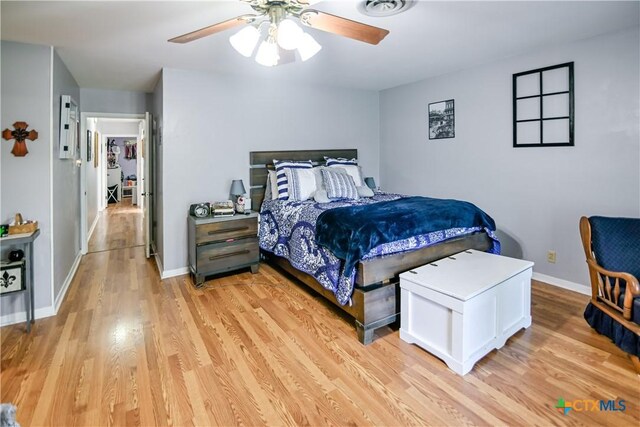 904 Iola St, Victoria, TX 77904 - bedroom with light wood-style floors, baseboards, and ceiling fan