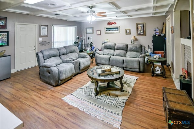 904 Iola St, Victoria, TX 77904 - living area featuring coffered ceiling, a ceiling fan, wood finished floors, and beam ceiling