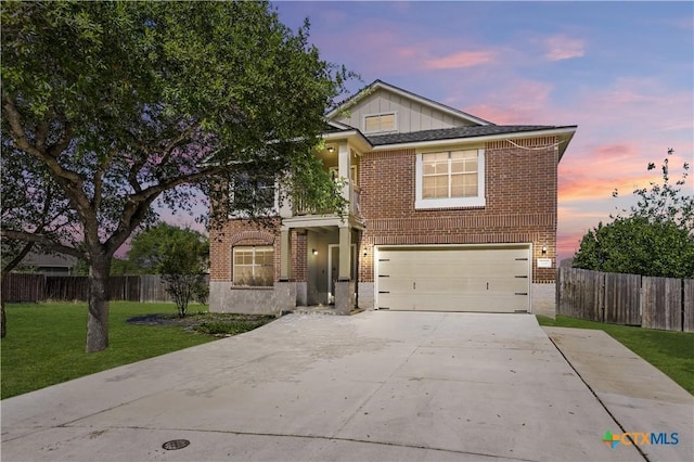 2441 Ibis Ave, New Braunfels, TX 78130 - traditional-style home featuring concrete driveway, an attached garage, a front yard, brick siding, and fence
