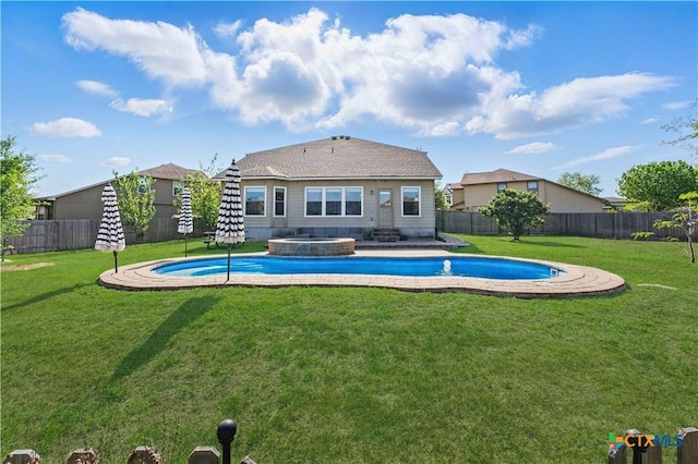 2441 Ibis Ave, New Braunfels, TX 78130 - view of swimming pool with a yard, a fenced backyard, and a pool with connected hot tub