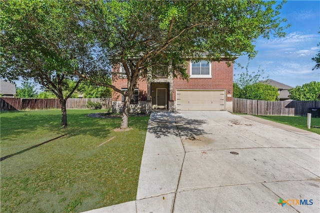 2441 Ibis Ave, New Braunfels, TX 78130 - view of front of home with fence, a front lawn, brick siding, an attached garage, and concrete driveway