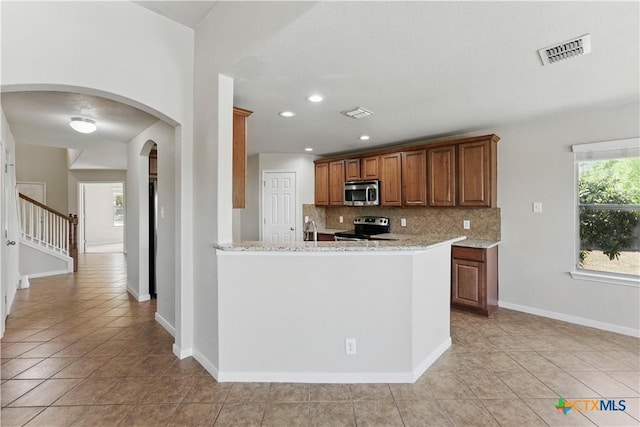 2441 Ibis Ave, New Braunfels, TX 78130 - kitchen with visible vents, decorative backsplash, appliances with stainless steel finishes, and light tile patterned floors
