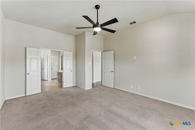2441 Ibis Ave, New Braunfels, TX 78130 - unfurnished bedroom featuring visible vents, baseboards, ceiling fan, light carpet, and lofted ceiling