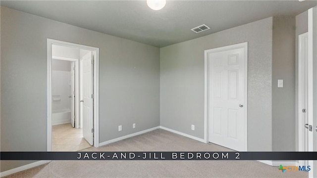 2441 Ibis Ave, New Braunfels, TX 78130 - unfurnished bedroom with carpet flooring, baseboards, and visible vents
