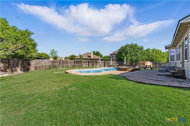 2441 Ibis Ave, New Braunfels, TX 78130 - view of yard with a patio area, a fenced backyard, and a pool with connected hot tub
